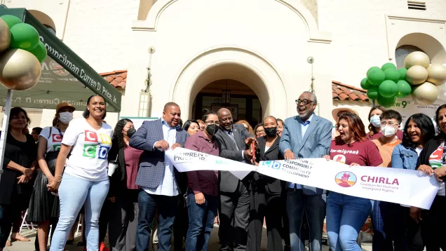 Councilmember with group ribbon cutting